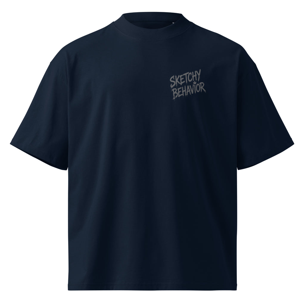 Blaster 2.0 unisex organic oversized high-neck t-shirt in French Navy, front view — small black "Sketchy Behavior" spray-style lettering on the left chest