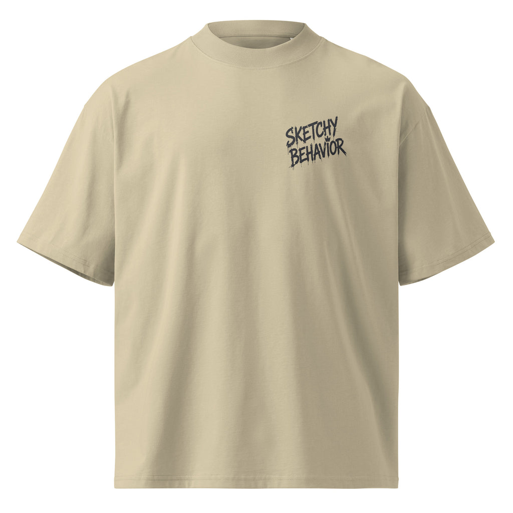 Blaster 2.0 unisex organic oversized high-neck t-shirt in Stone, front view — small black "Sketchy Behavior" spray-style lettering on the left chest